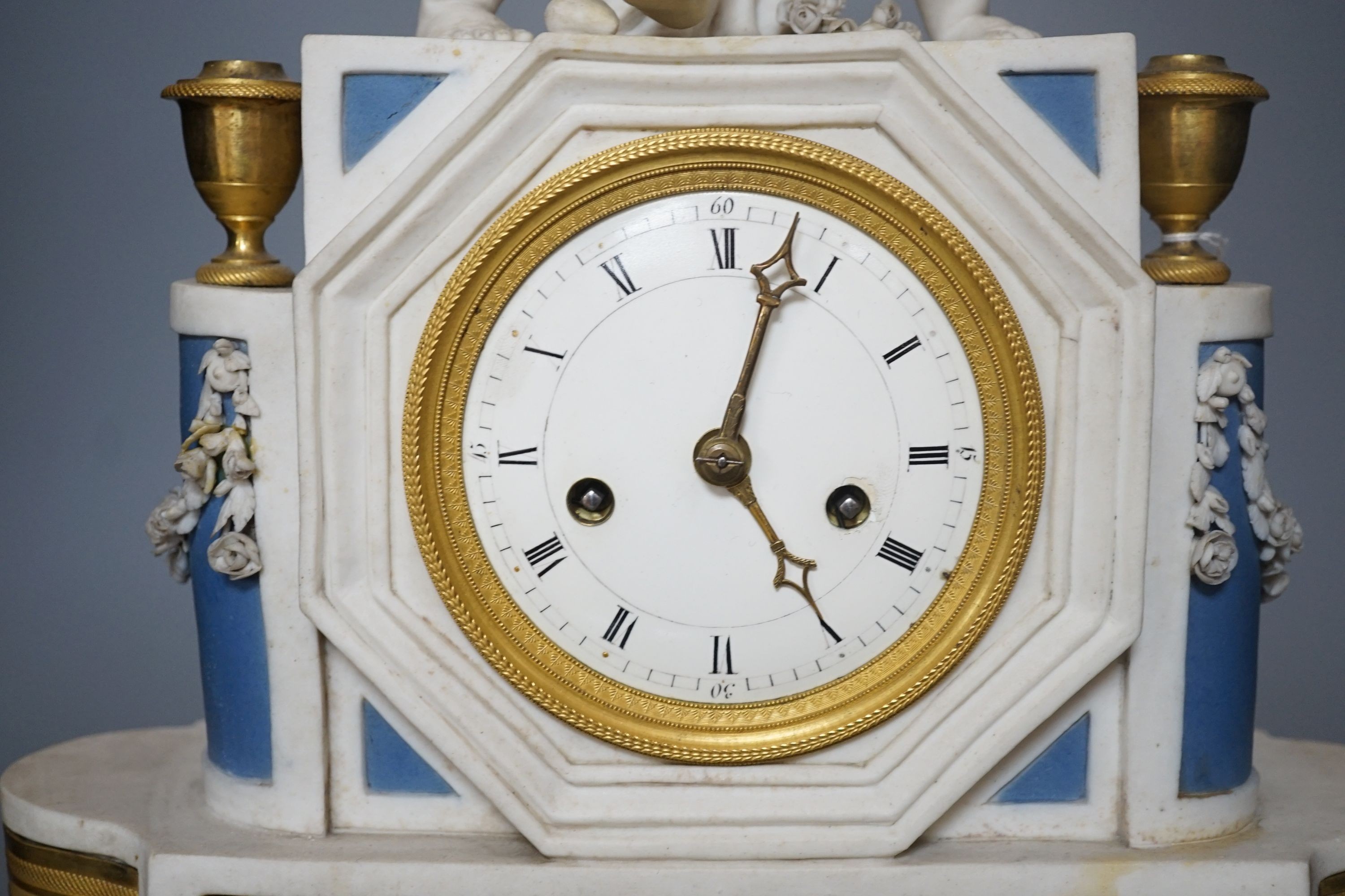 A 19th century French biscuit porcelain and ormolu mounted mantel clock, 43 cm high